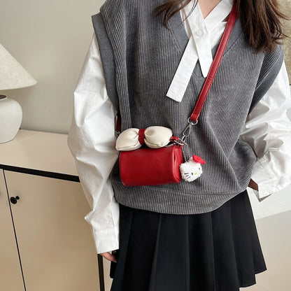 Bow Accent Cylinder Crossbody Bag