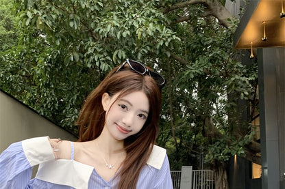 Long-Sleeve Cold Shoulder Striped Asymmetrical Button-Up Blouse