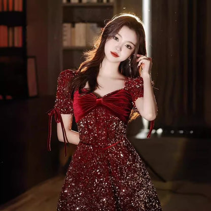 Puff-Sleeve V-Neck Sequin Bow Accent A-Line Evening Gown