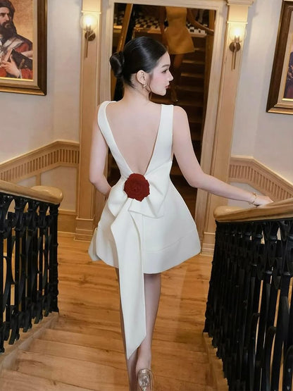 Sleeveless Boat Neck Bow Accent Open Back Mini A-Line Cocktail Dress