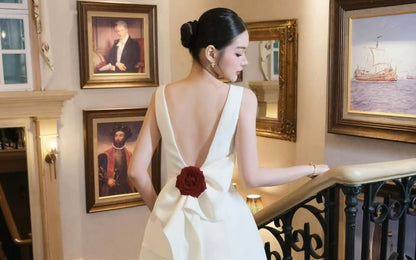 Sleeveless Boat Neck Bow Accent Open Back Mini A-Line Cocktail Dress