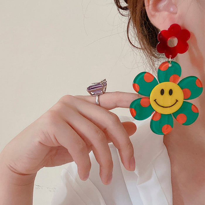 Boucles d'oreilles jolies fleurs souriantes