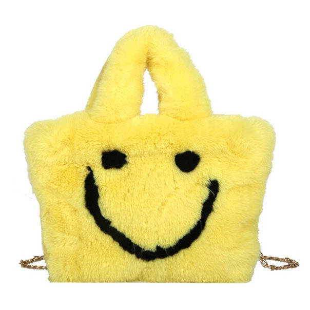 Sac à main pelucheux avec visage souriant