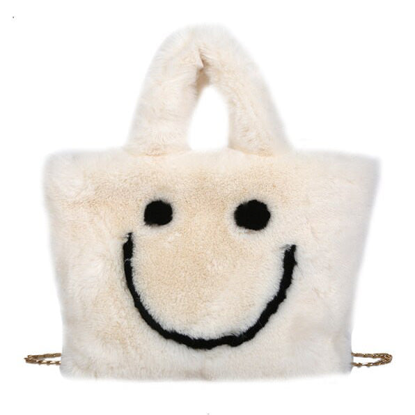 Sac à main pelucheux avec visage souriant