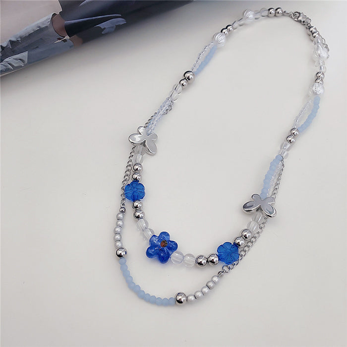 Collier de perles à fleurs bleues