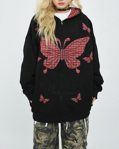 This 90's grunge hoodie features an oversized fit, plaid butterfly patches on the chest and sleeves, and a zip-up closure on the front. The hood is lined with red plaid fabric - boogzel clothing