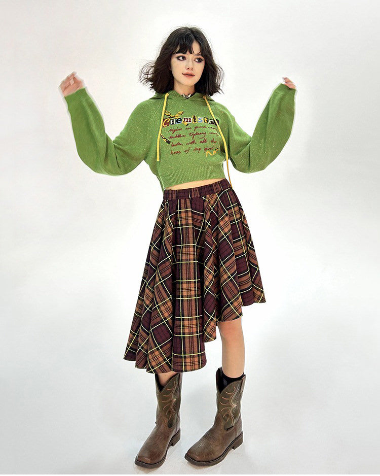 This preppy cropped hoodie in green features a cute 'Chemistry' print, ruffled collar details, and a knit construction