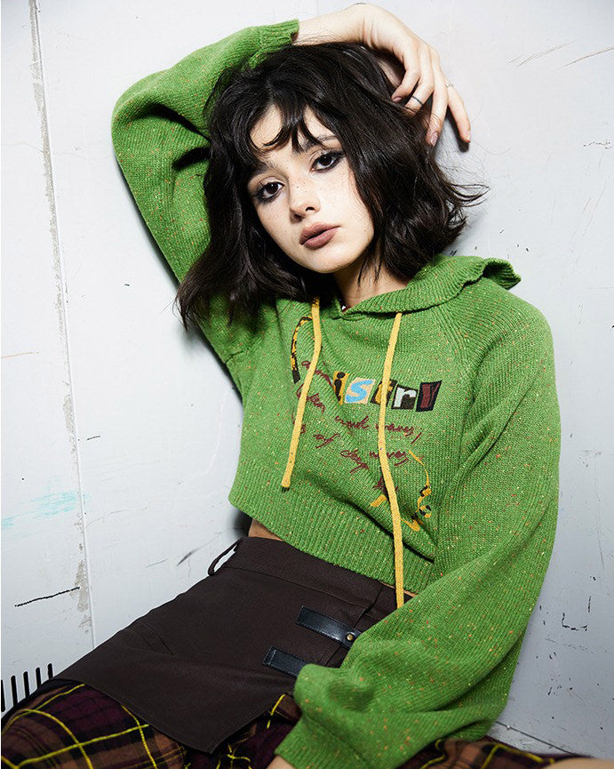 This preppy cropped hoodie in green features a cute 'Chemistry' print, ruffled collar details, and a knit construction