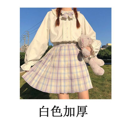 Chemisier à manches longues et bordure à volants