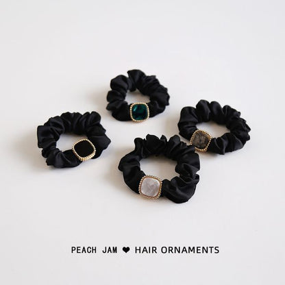 Élastique à cheveux avec bouton