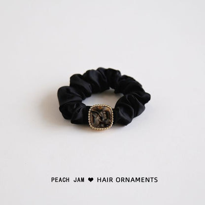 Élastique à cheveux avec bouton