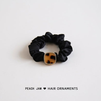 Élastique à cheveux avec bouton