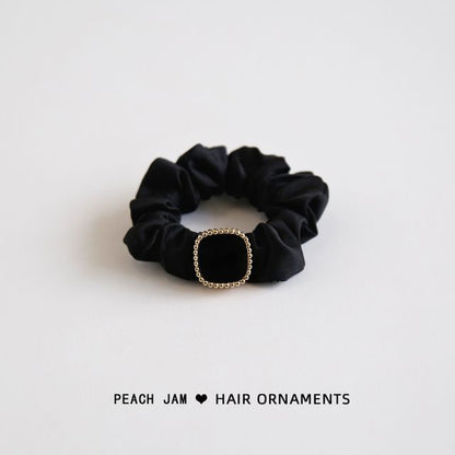 Élastique à cheveux avec bouton