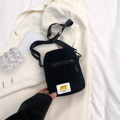 Sac bandoulière à appliques