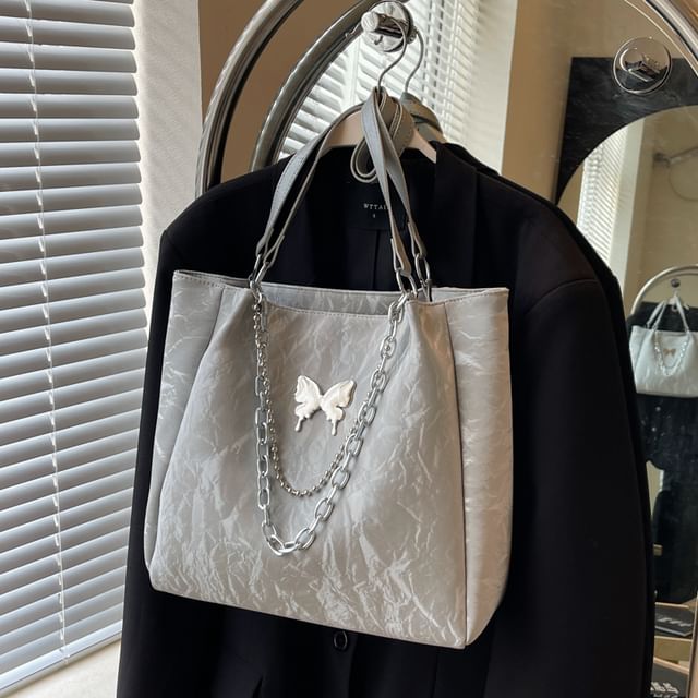 Butterfly Accent Chained Faux Leather Tote Bag