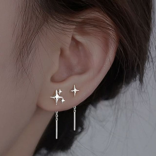 Boucle d'oreille asymétrique en alliage avec étoile