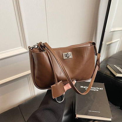 Faux Leather Twist Lock Crossbody Bag