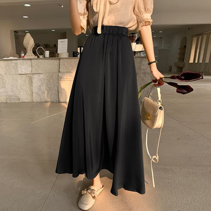 Solid High-Rise Flared Maxi Skirt with Clean Lines