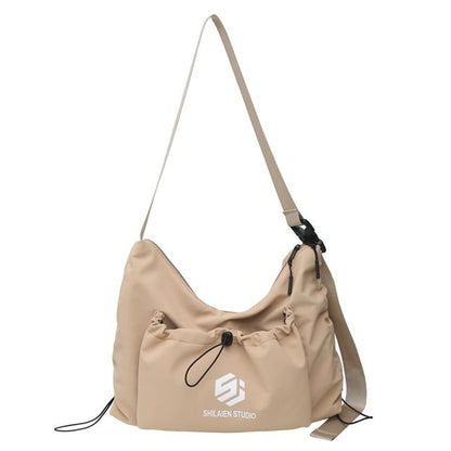 Sac à bandoulière avec cordon de serrage et lettrage