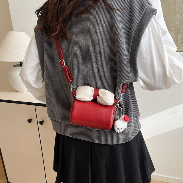 Bow Accent Cylinder Crossbody Bag