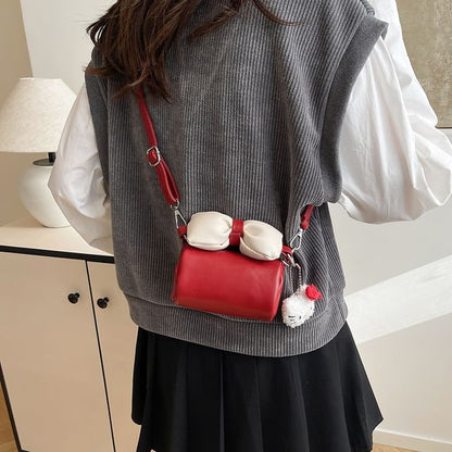 Bow Accent Cylinder Crossbody Bag