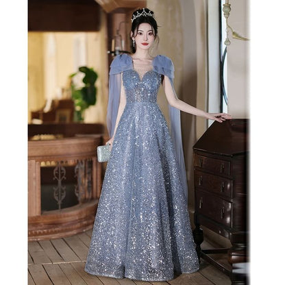 Sleeveless Crew Neck Sequin Sheer Panel Bow Accent A-Line Evening Gown