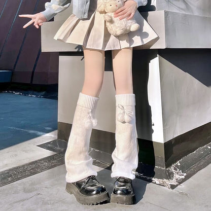 Jambières moelleuses à pompon