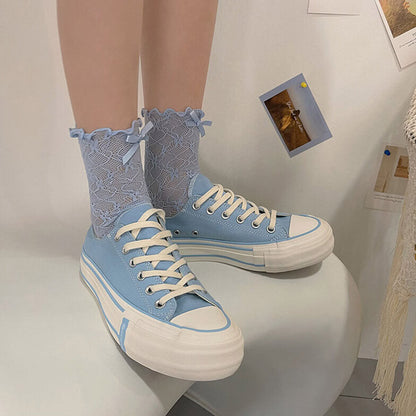 Chaussettes en dentelle avec nœud fleuri