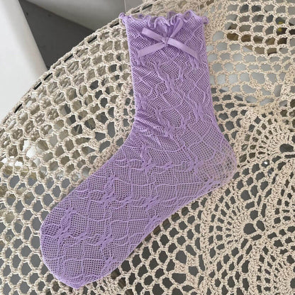 Chaussettes en dentelle avec nœud fleuri