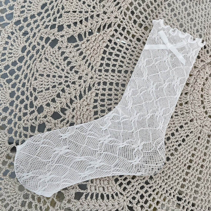 Chaussettes en dentelle avec nœud fleuri