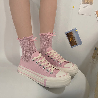 Chaussettes en dentelle avec nœud fleuri