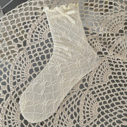 Chaussettes en dentelle avec nœud fleuri