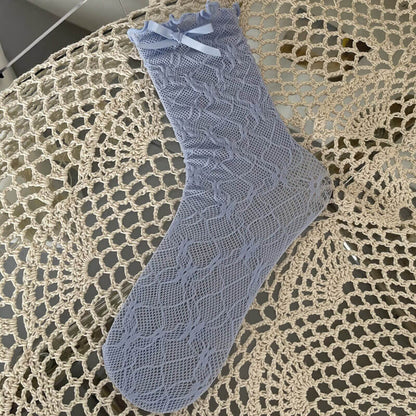Chaussettes en dentelle avec nœud fleuri