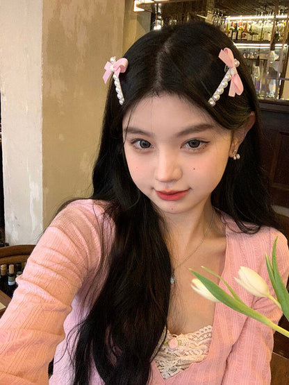 Süße Haarspange mit Perlen und Schleife