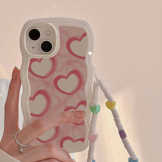 Coque de téléphone avec bracelet en forme de cœur rose